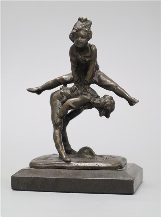 A bronze of two leap frogging children, indistinctly signed height 14cm